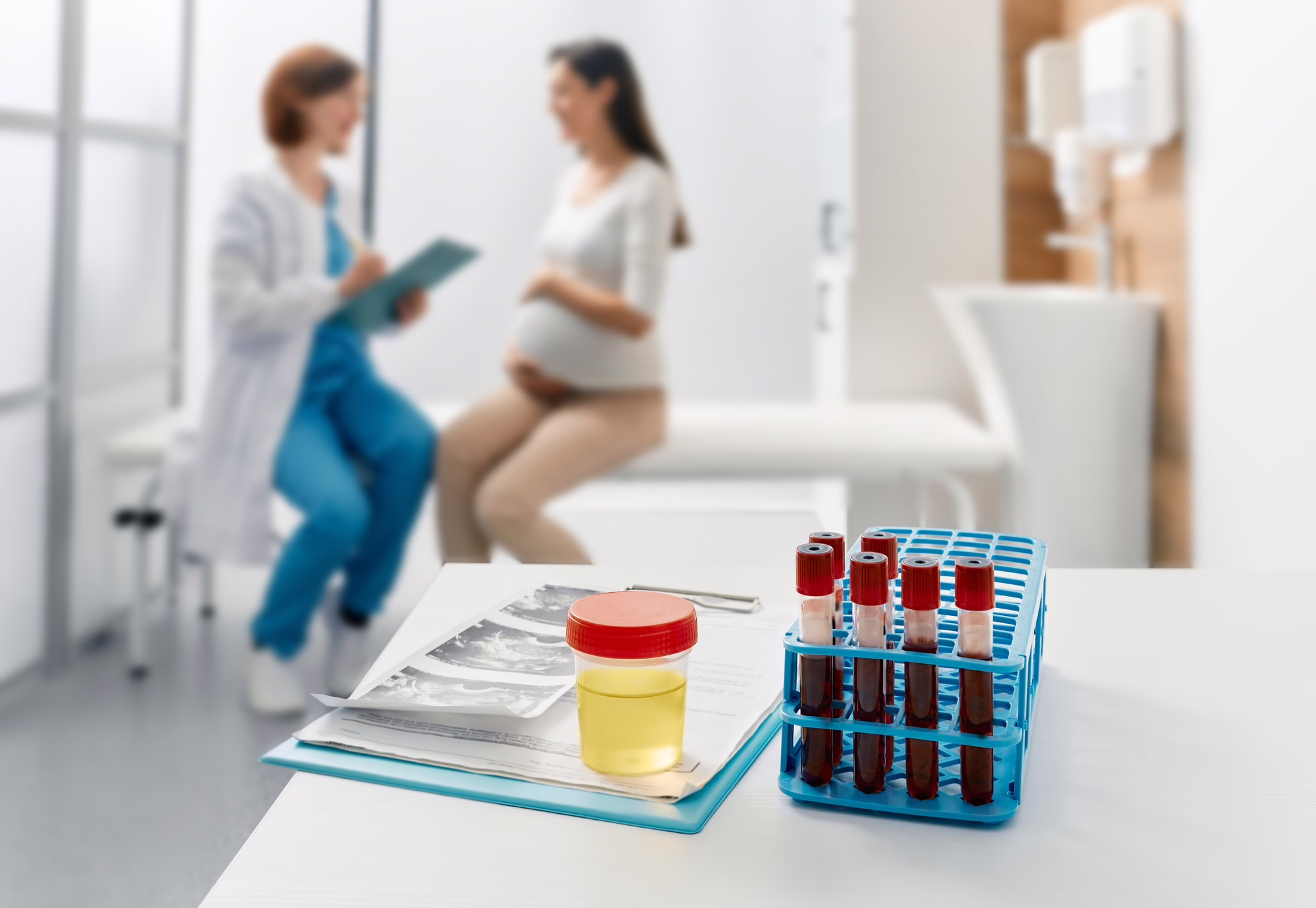 Routine blood and urine tests during pregnancy. Pregnant woman being examined by gynecologist